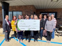 Donation from Infuze CU with Big check