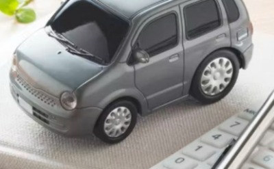 a model car sitting on top of a journal