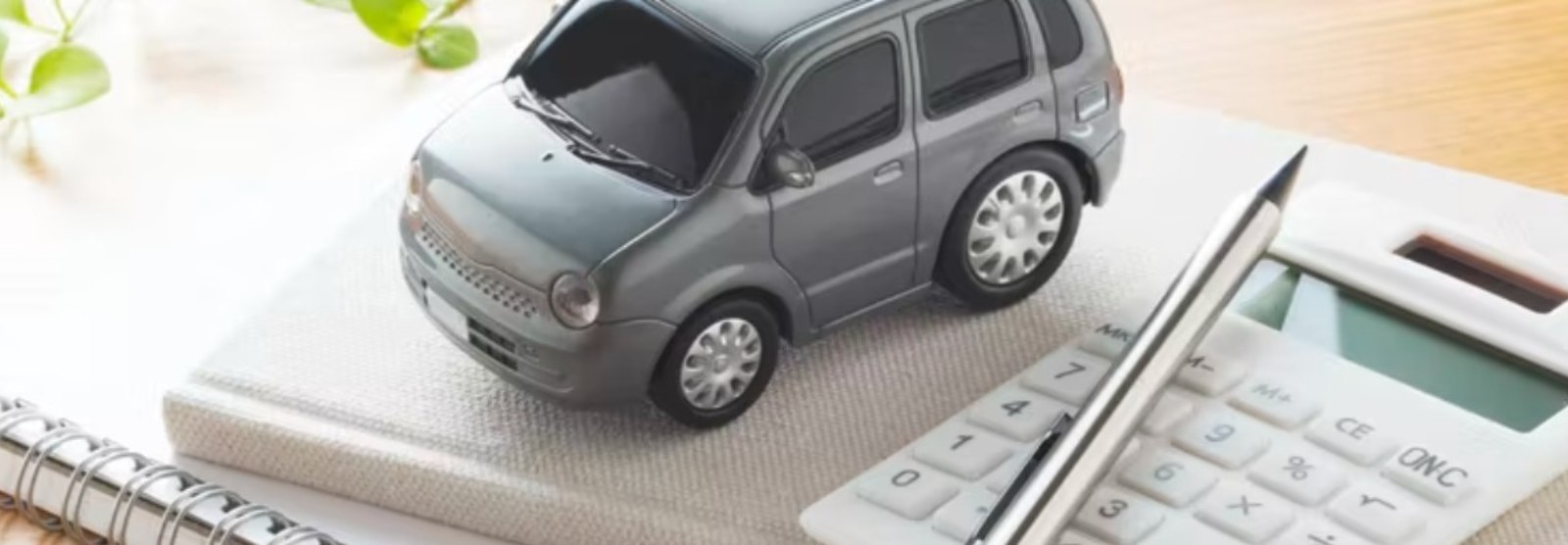 a model car sitting on top of a journal