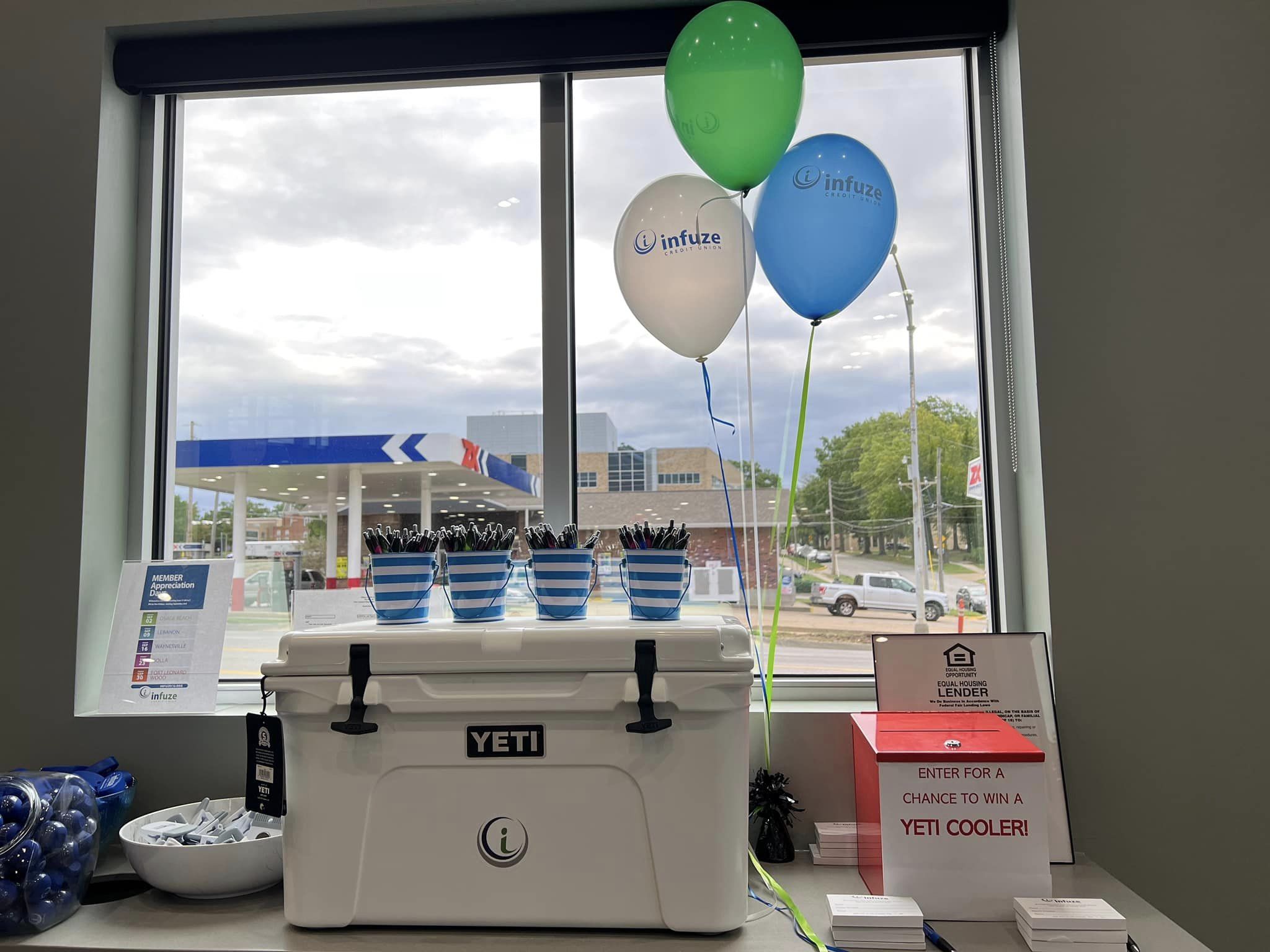 Ice chest with balloons.