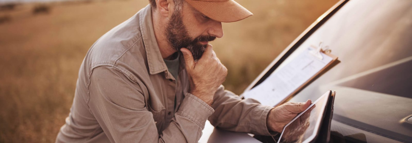 a farmer looking at his tablet