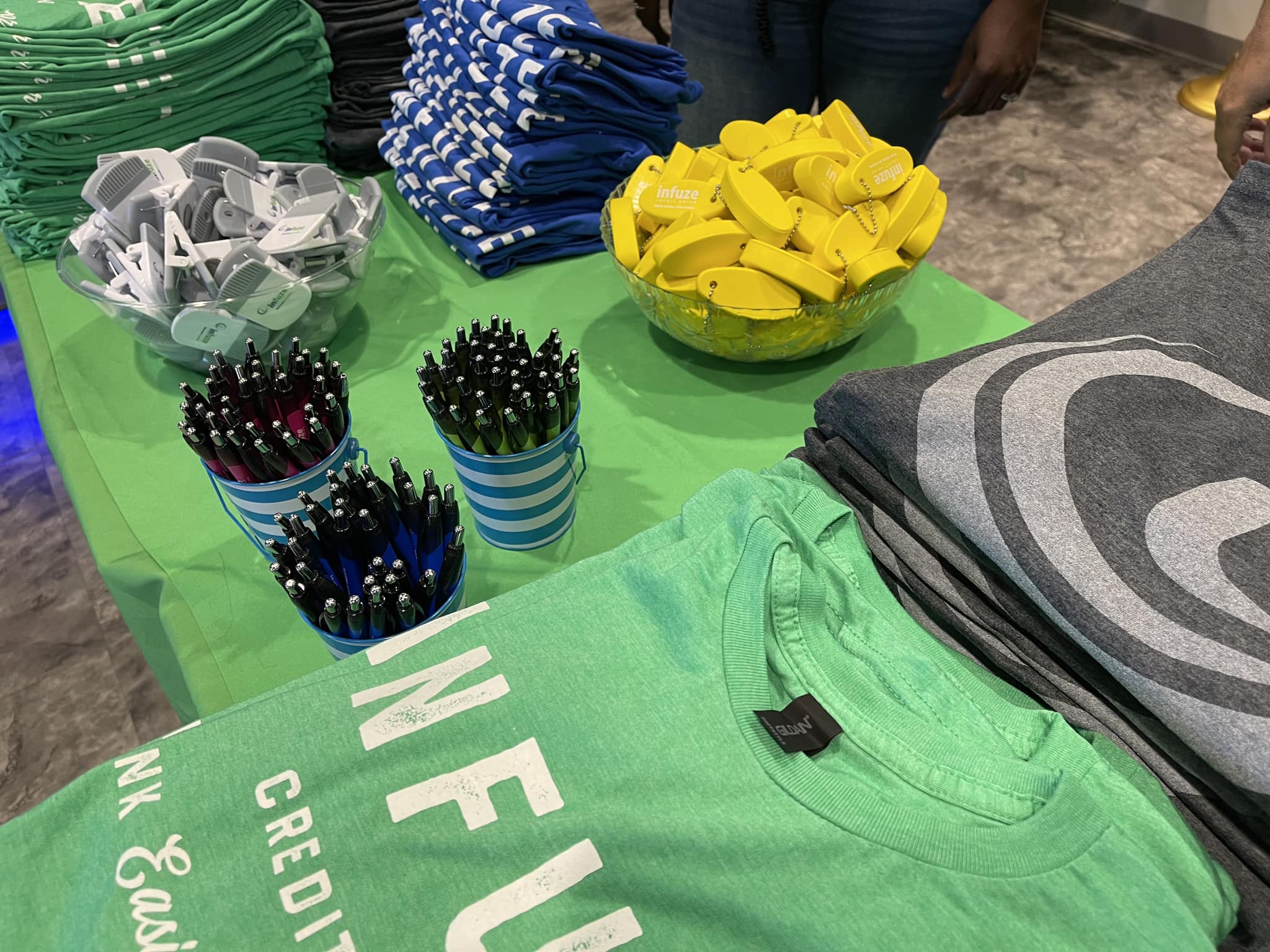 Shirts, pens, and keychains.
