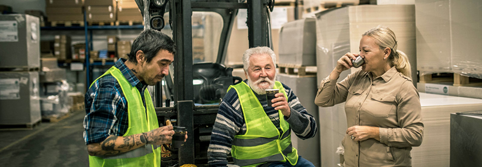 group of warehouse workers having coffee together.
